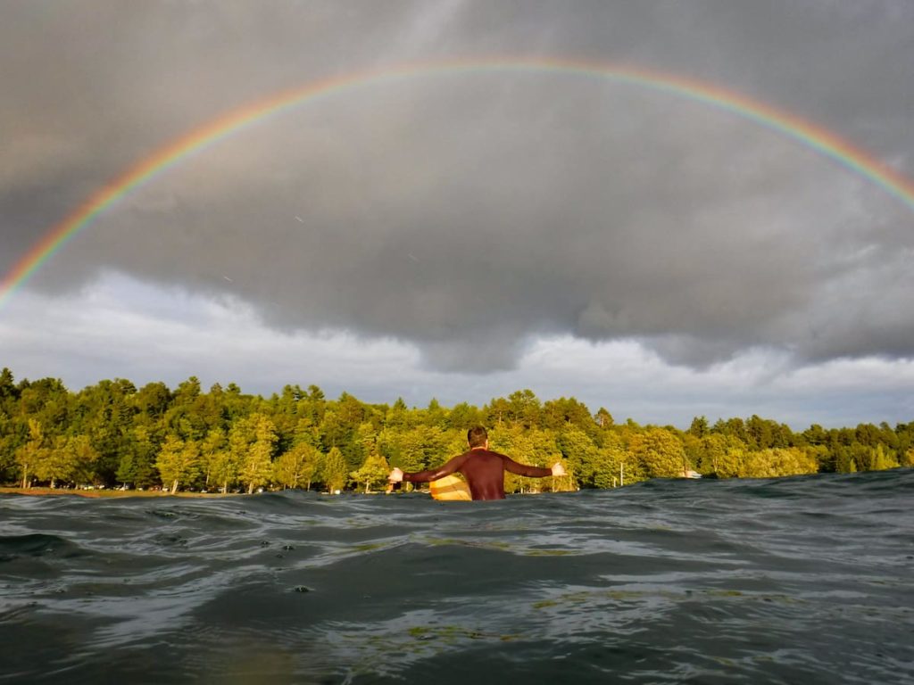 Marquette Michigan surfing at the zoo with a rainbow