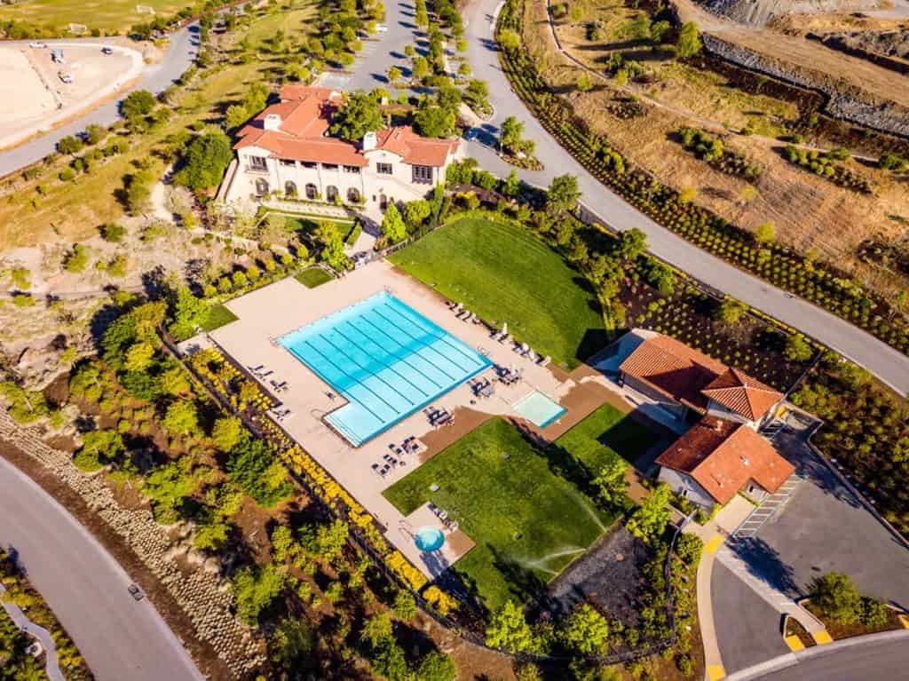 real estate drone photography of lavish house with swimming pool